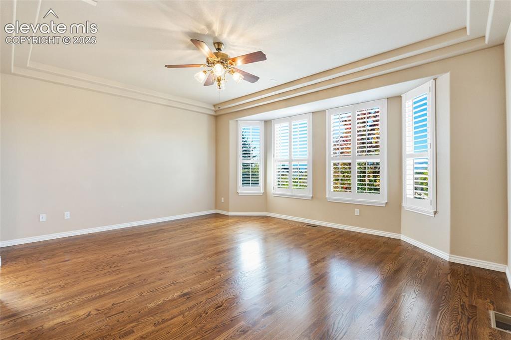 Image 20 of 50: Interior space featuring wood-finish flooring, recessed ceiling detailing,