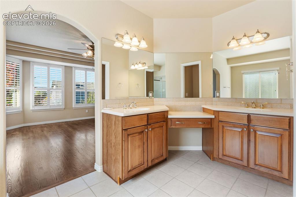 Image 21 of 50: PRIMARY ENSUITE BATHROOM WITH DUAL VANITIES