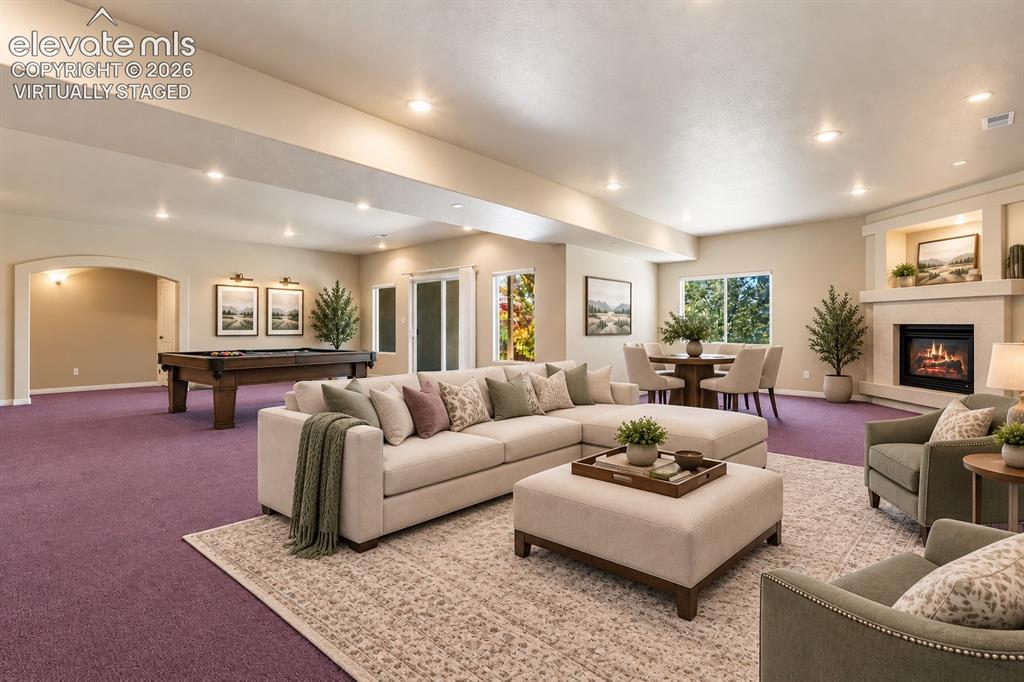 Image 30 of 50: VIRTUALLY STAGED - BASEMENT WITH WALK OUT AND FIREPLACE