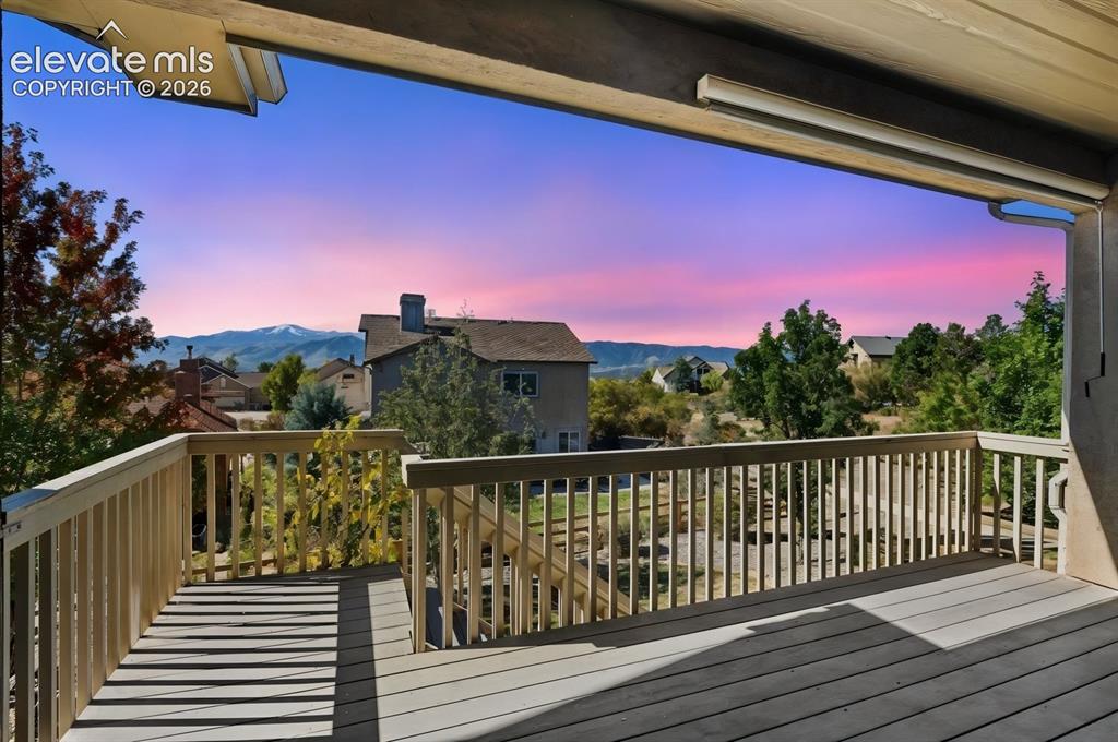 Image 48 of 50: AMAZING VIEWS OF PIKES PEAK AND USAFA AT SUNSET FROM THE COVERED DECK