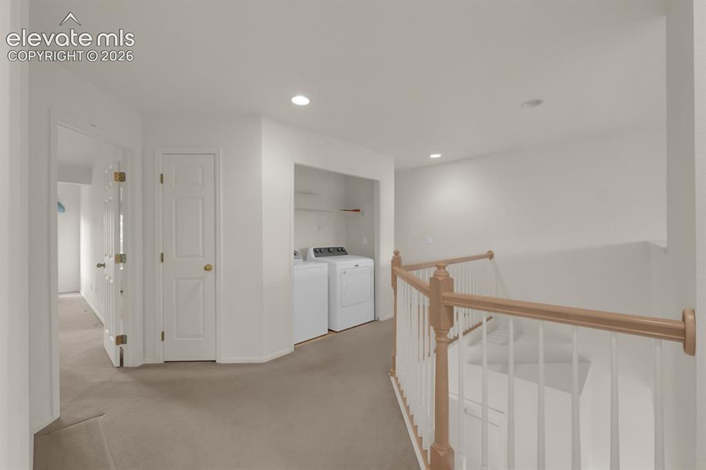 Image 12 of 30: Laundry closest off upper hallway