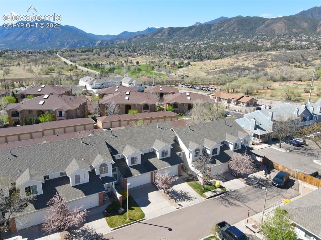 Image 24 of 30: Townhome community featuring individual garages and dormer windows