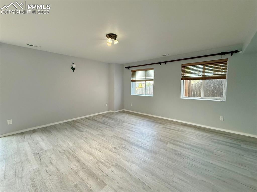 Image 25 of 37: Unfurnished room with light wood-type flooring