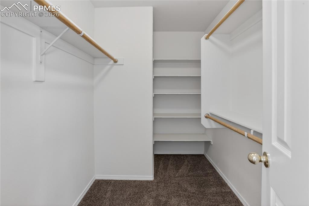 Image 14 of 24: Walk-in primary closet