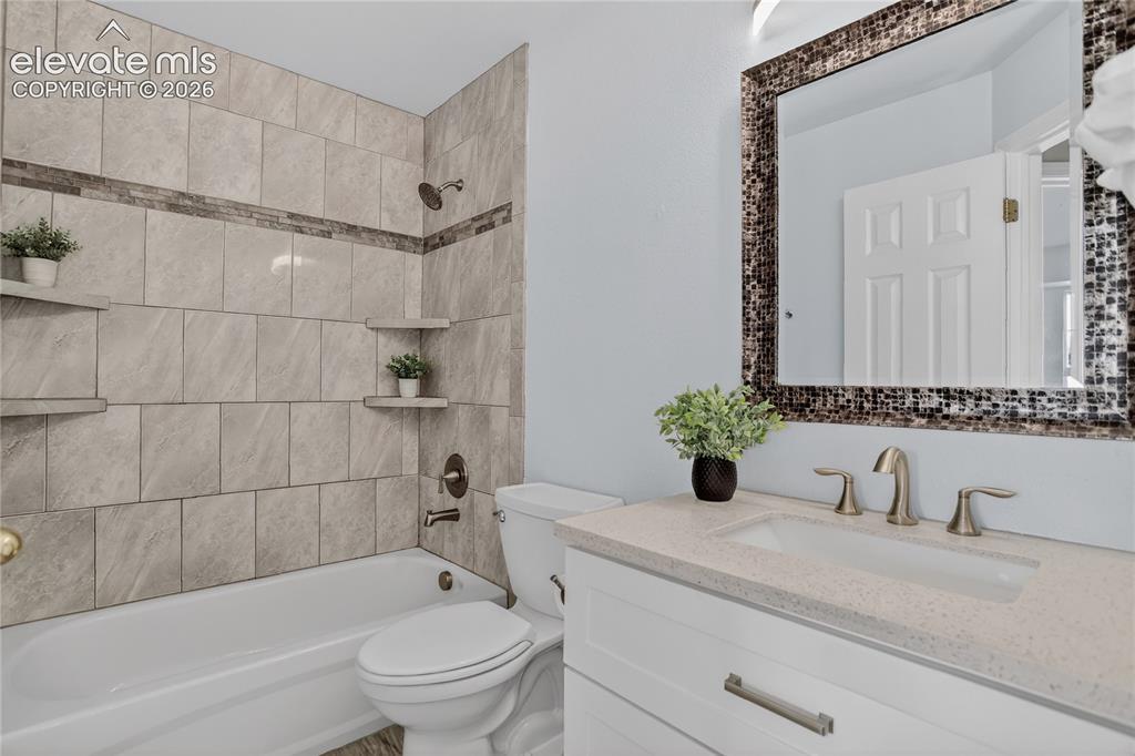 Image 17 of 24: Full guest bath - upper level