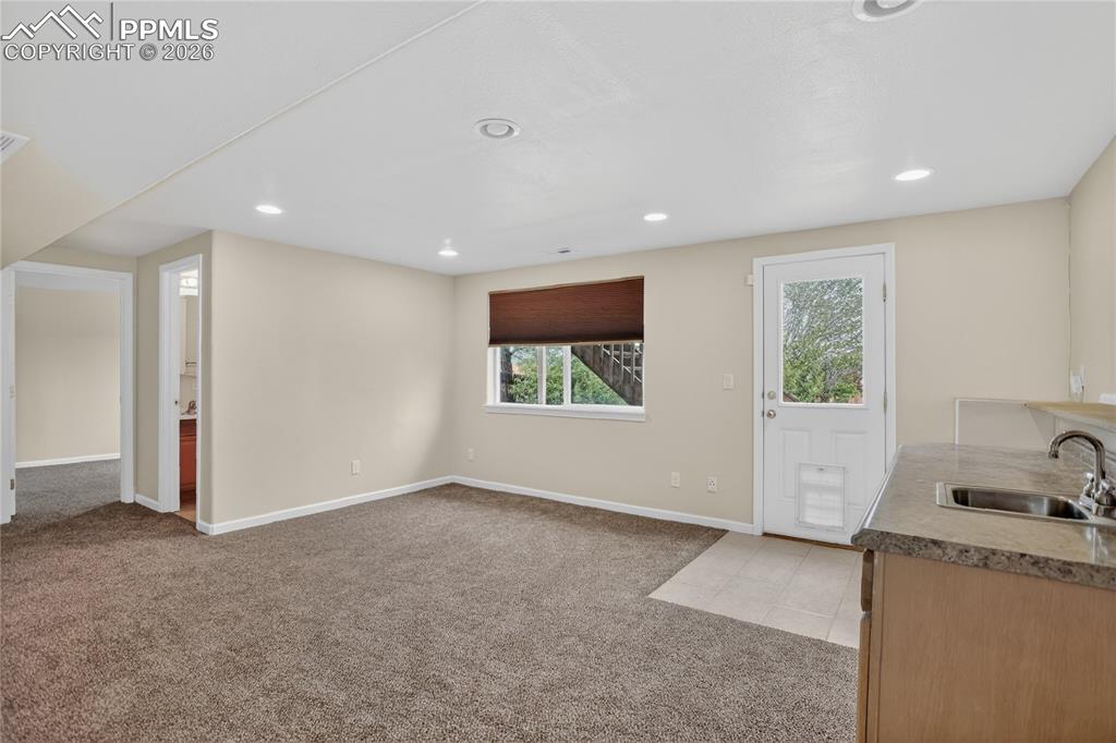 Image 18 of 24: Rec room w/ walk-out - lower level