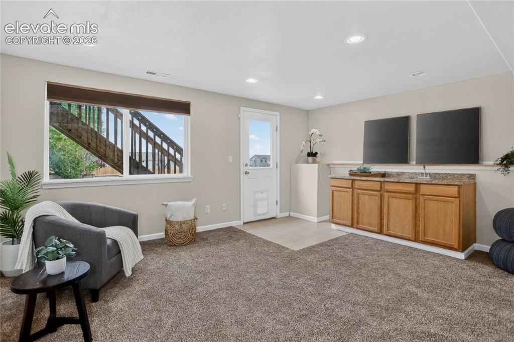 Image 18 of 24: Rec room w/ walk-out - lower level