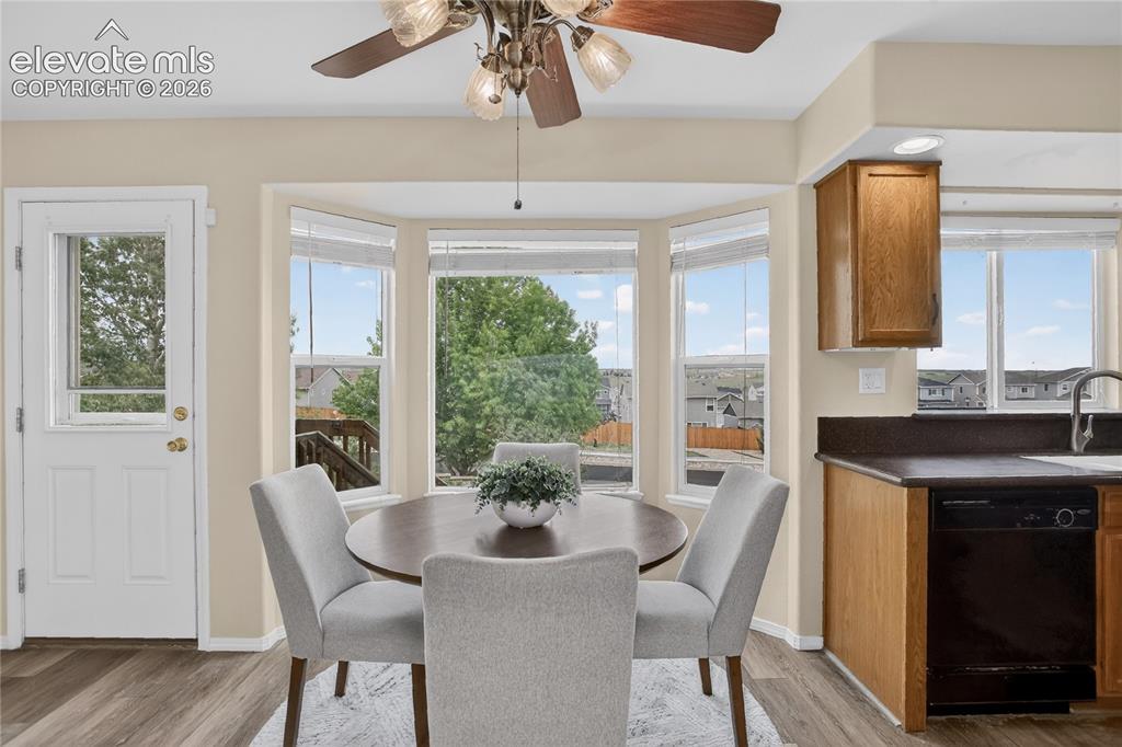 Image 6 of 24: Dining nook & walk-out to deck