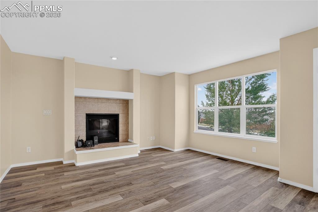 Image 8 of 24: Family room w/ fireplace - main level