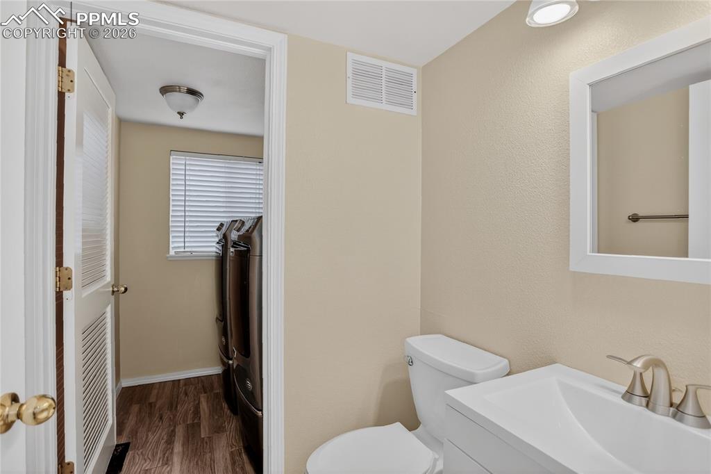 Image 9 of 24: Powder room & laundry - main level