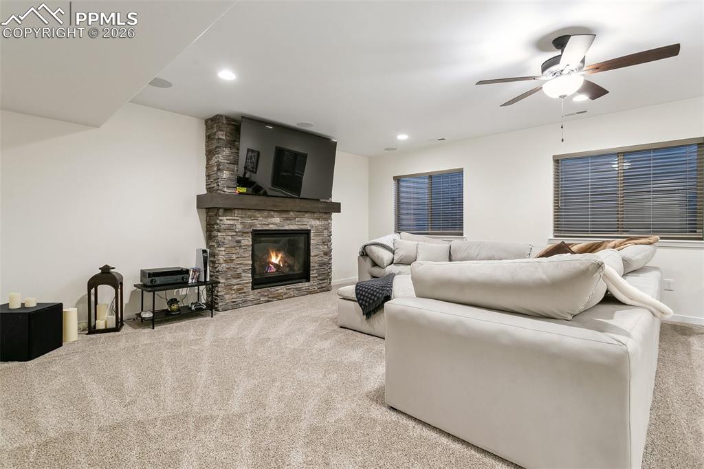 Image 37 of 50: Basement with gas fireplace