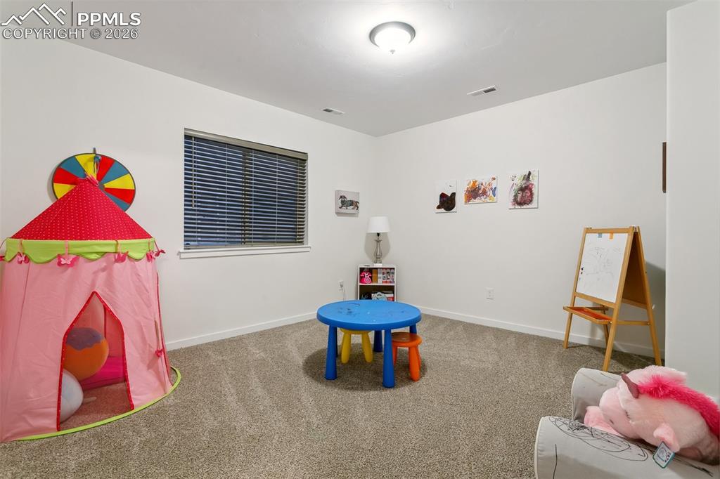 Image 40 of 50: Basement bedroom