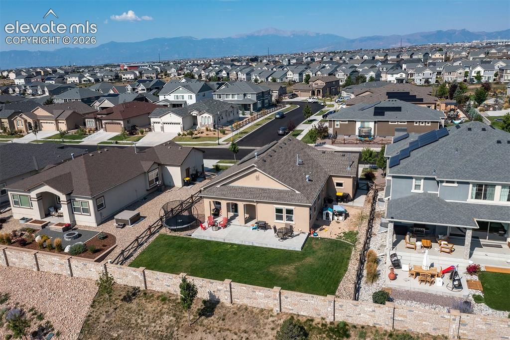 Image 40 of 43: Expansive neighborhood featuring a mix of single-family homes with pitched 