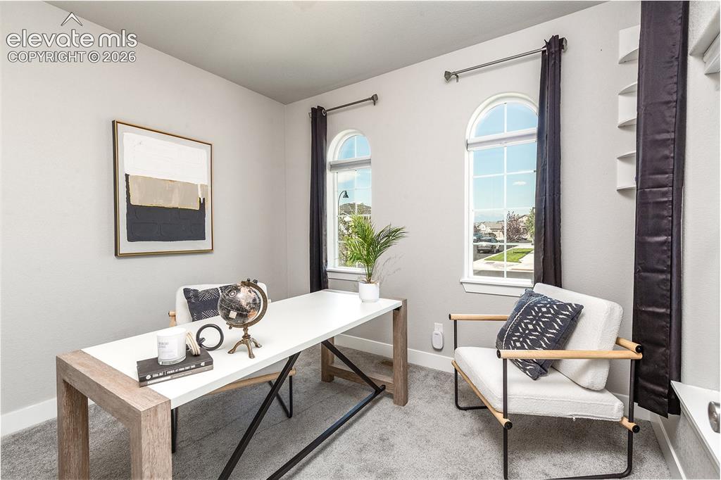 Image 9 of 43: Main level bedroom. Currently staged as an office.