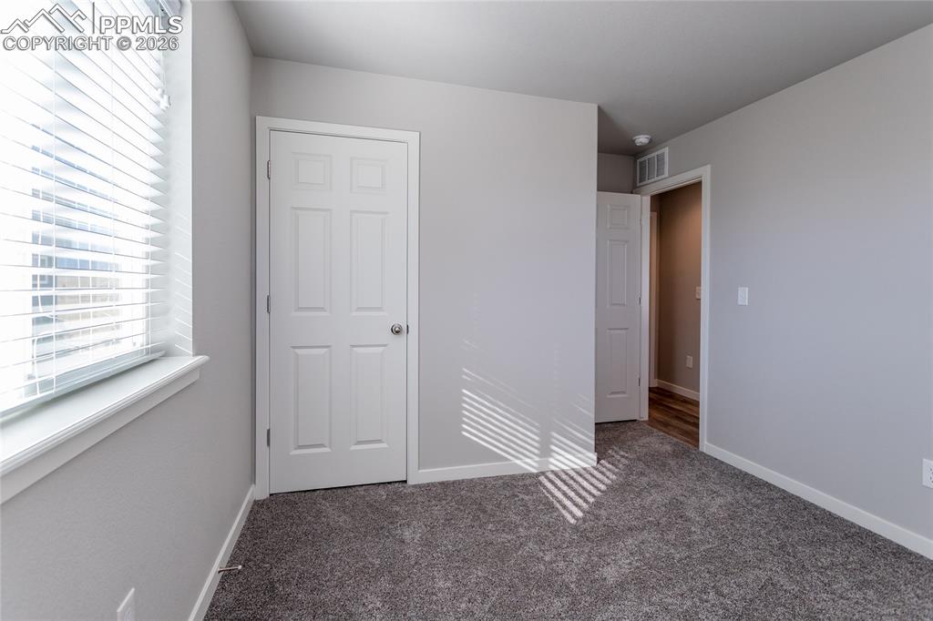 Image 22 of 34: second-level bedroom