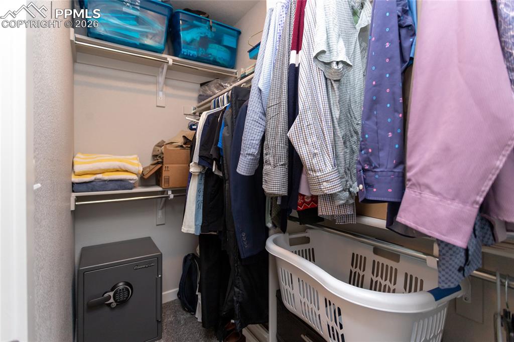Image 30 of 34: Large closet in primary bedroom
