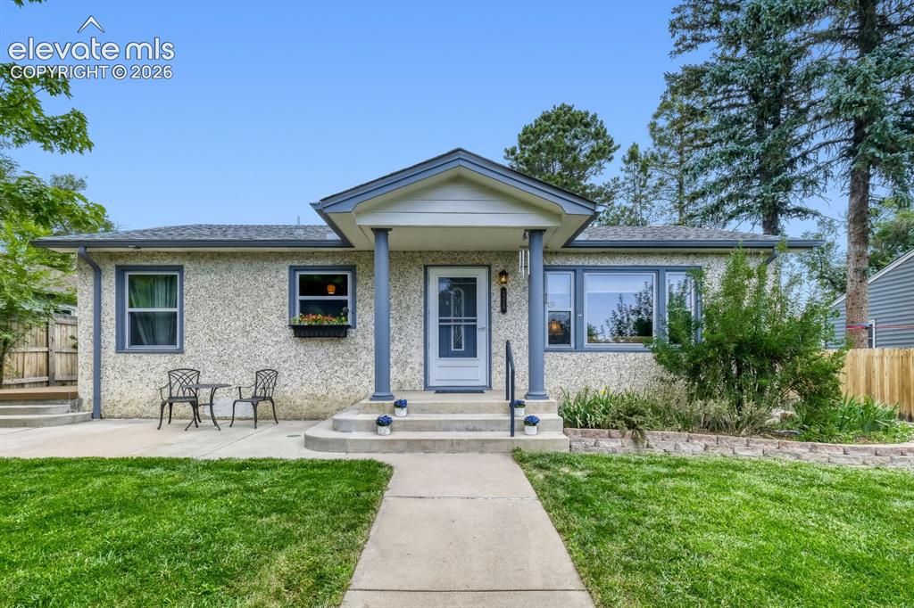Image 1 of 50: Single-story residence featuring a stucco exterior and gabled entry porch