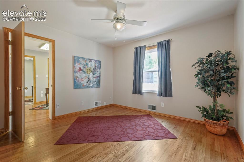 Image 17 of 50: Hardwood-style flooring throughout