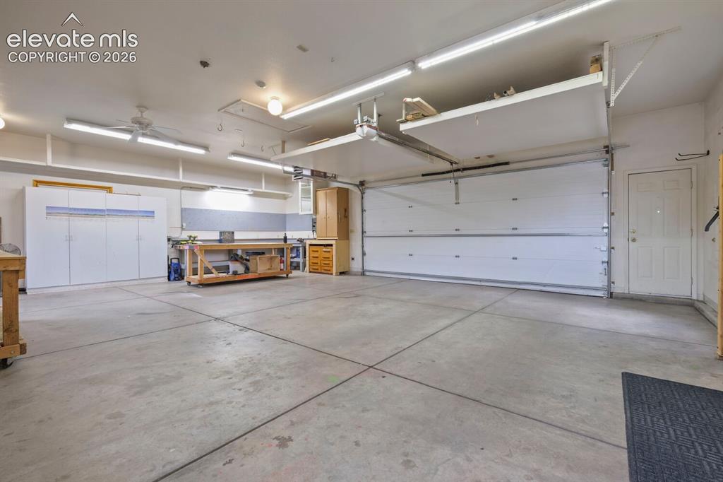 Image 29 of 50: Storage shed interior featuring exposed wood framing, oriented strand board