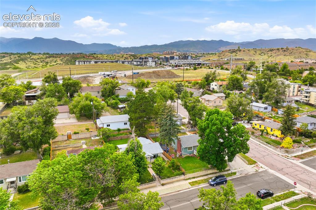 Image 43 of 50: Neighborhood setting featuring established residential properties with matu