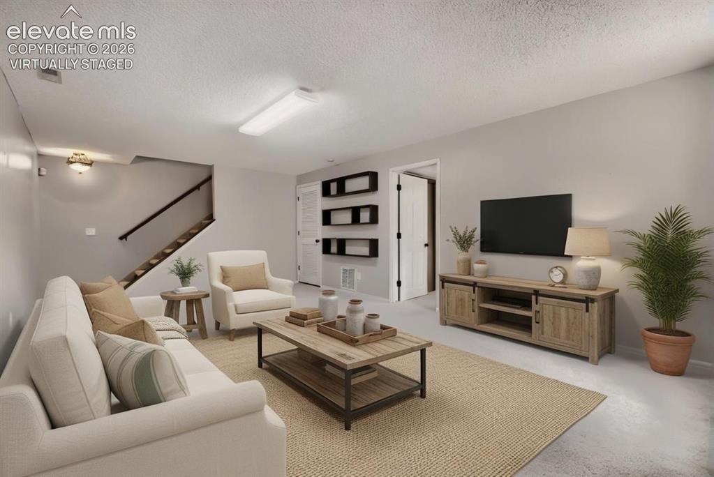 Image 12 of 28: Open-concept room featuring light gray walls and recessed lighting, virtual
