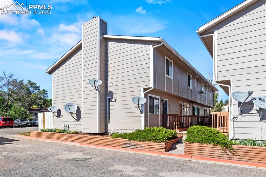 Caption: View of side of property with a chimney