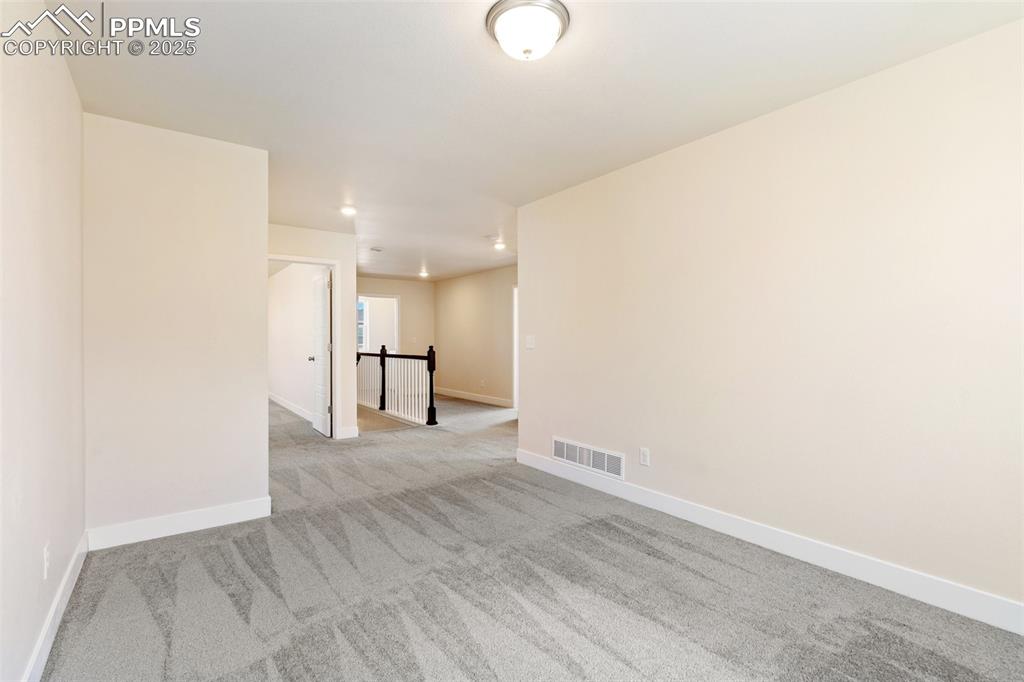 Image 17 of 35: Carpeted empty room featuring recessed lighting and baseboards