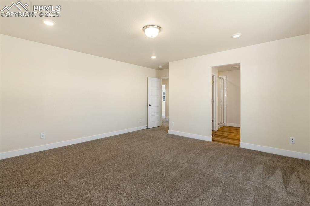 Image 18 of 35: Carpeted spare room featuring baseboards and recessed lighting