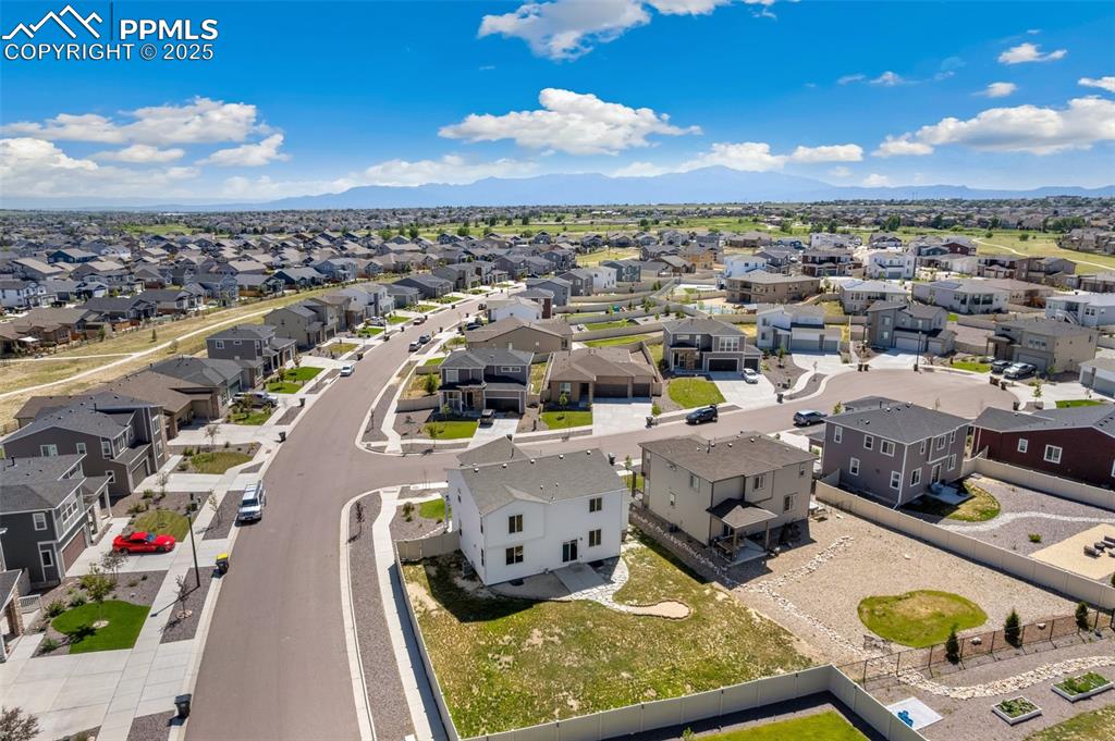 Image 29 of 35: Aerial perspective of suburban area featuring mountains