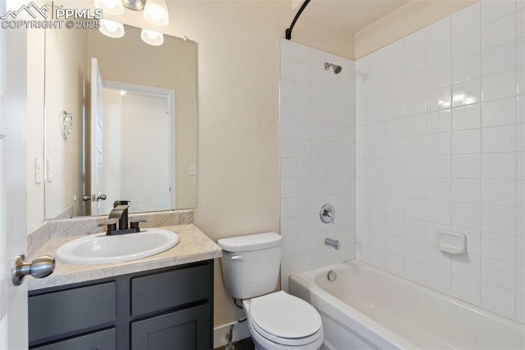 Image 3 of 35: Full bathroom with vanity and shower / bathtub combination