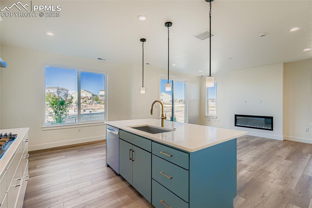 Image 9 of 28: Kitchen with healthy amount of natural light, pendant lighting, a kitchen i