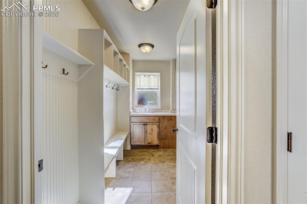 Image 22 of 38: Laundry/Mudroom with custom built-ins