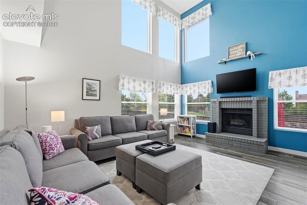 Image 20 of 50: Beautiful windows and gas fireplace