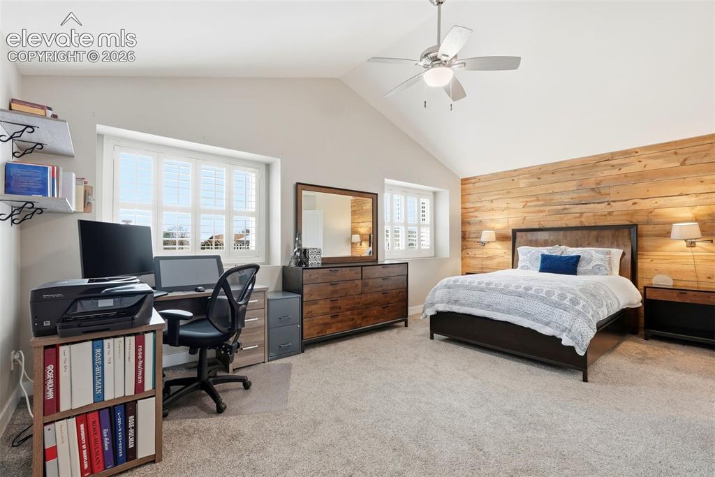 Image 27 of 50: Huge primary bedroom with pitched ceiling and Catalina shutters