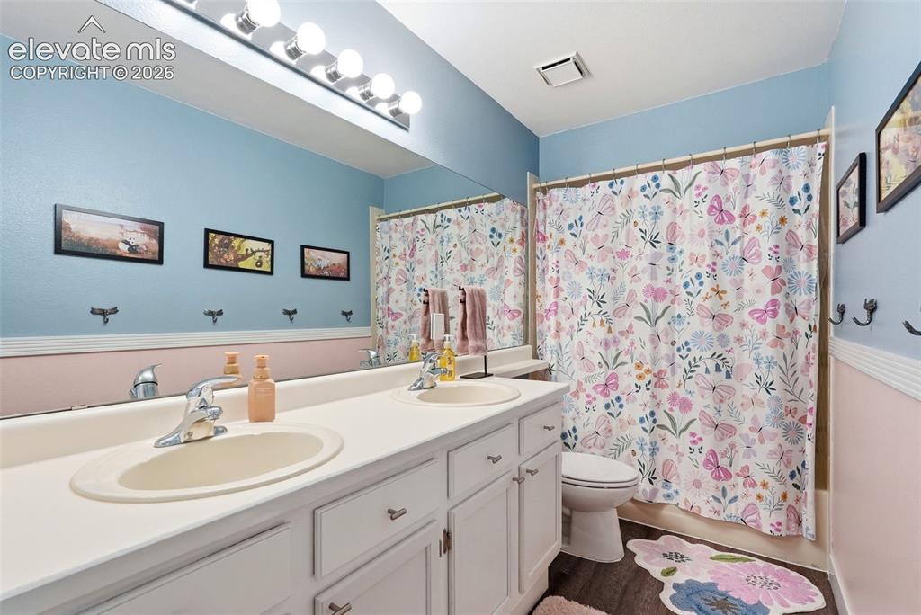 Image 38 of 50: Full Bath with dual sinks