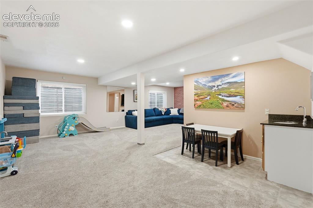 Image 44 of 50: Garden level basement family room