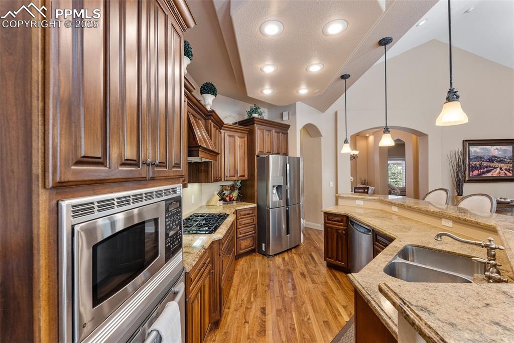 Image 12 of 50: Luxurious cabinets with a built-in oven and microwave
