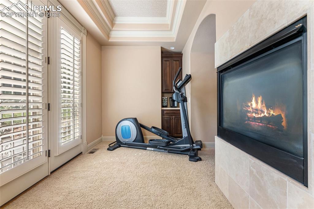 Image 20 of 50: Walk out access from the primary bedroom office/sitting space