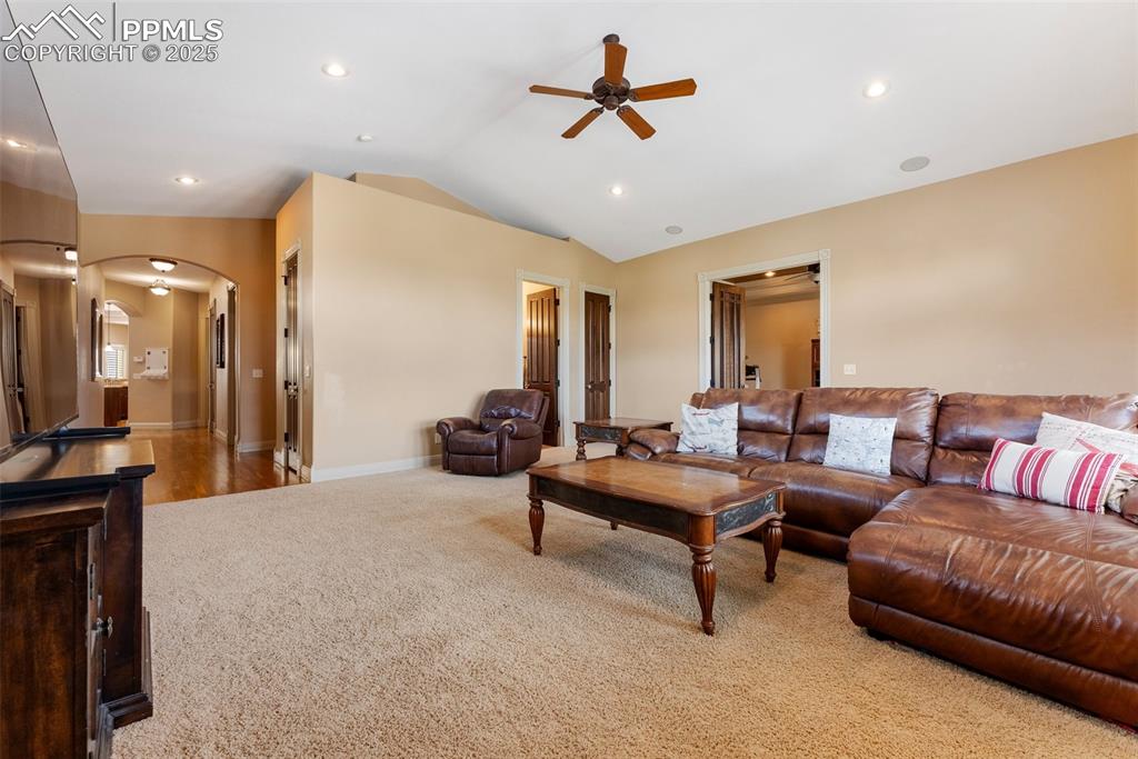Image 26 of 50: Second living room above the three car garage