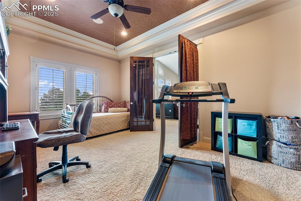 Image 30 of 50: Off the second living room through double french doors is another bedroom/o