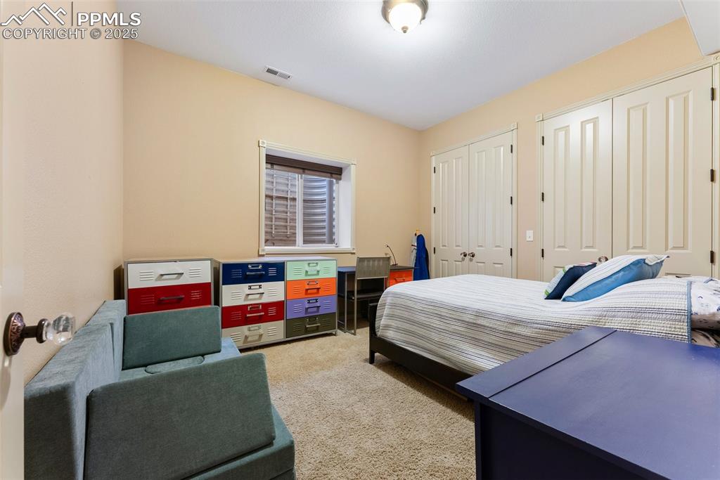 Image 40 of 50: Fifth bedroom with dual closets for extra storage