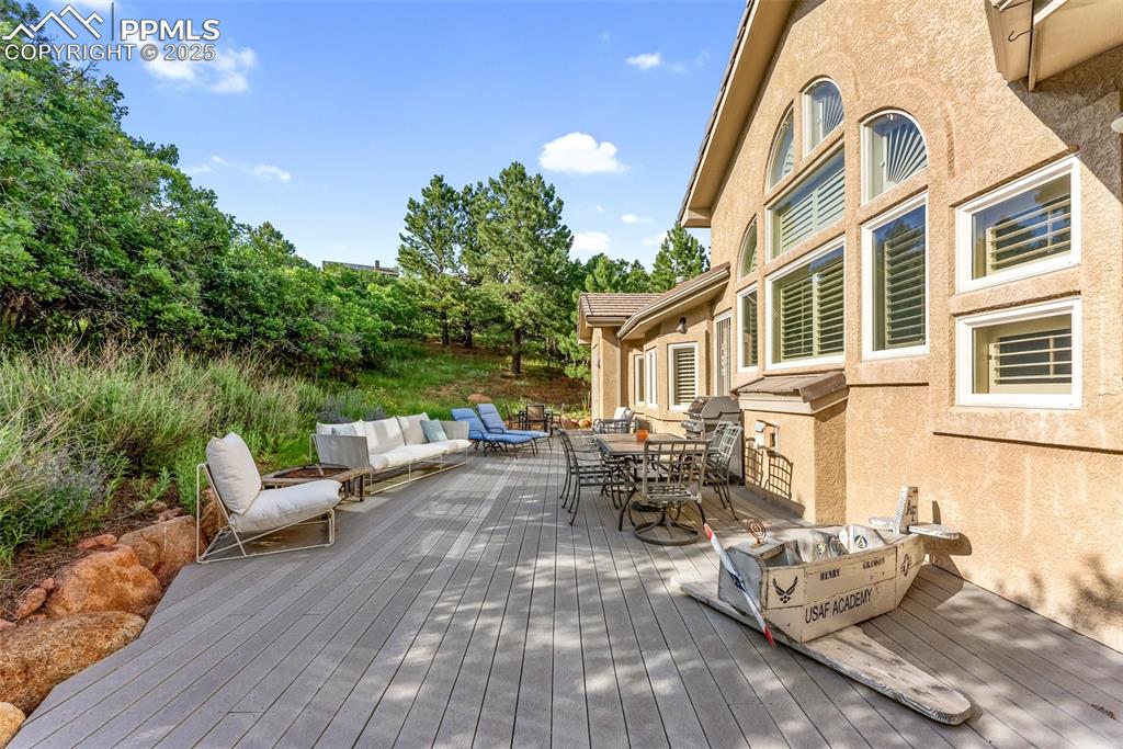 Image 44 of 50: Great back deck made with Trex and cut for a custom fit