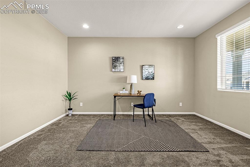 Image 12 of 42: Office space with carpet floors and recessed lighting
