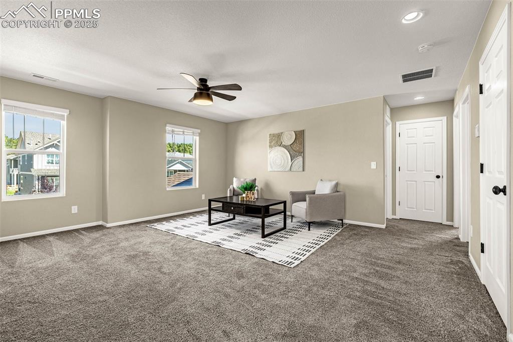 Image 21 of 42: Loft area featuring carpet, a ceiling fan, and recessed lighting