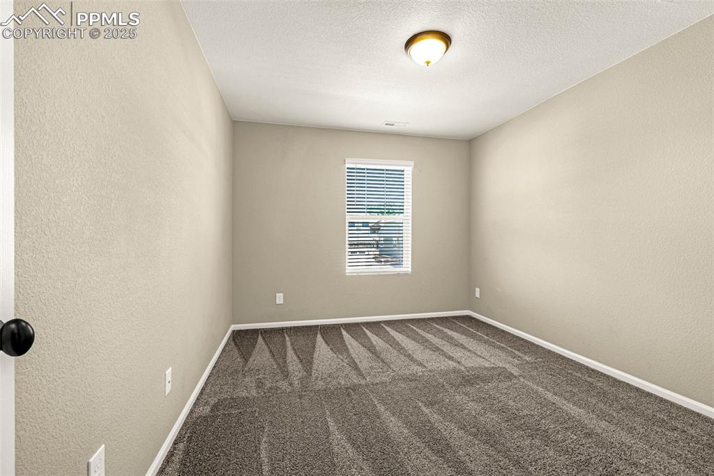 Image 31 of 42: Basement Bedroom
