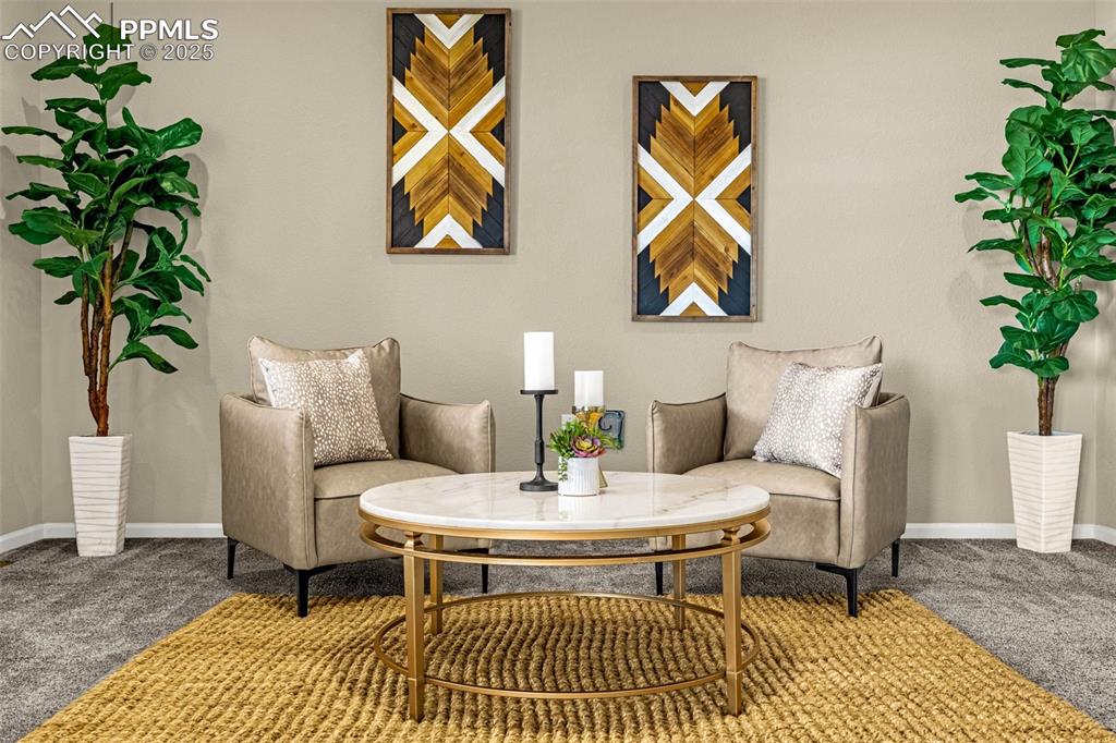 Image 7 of 42: Living area featuring carpet