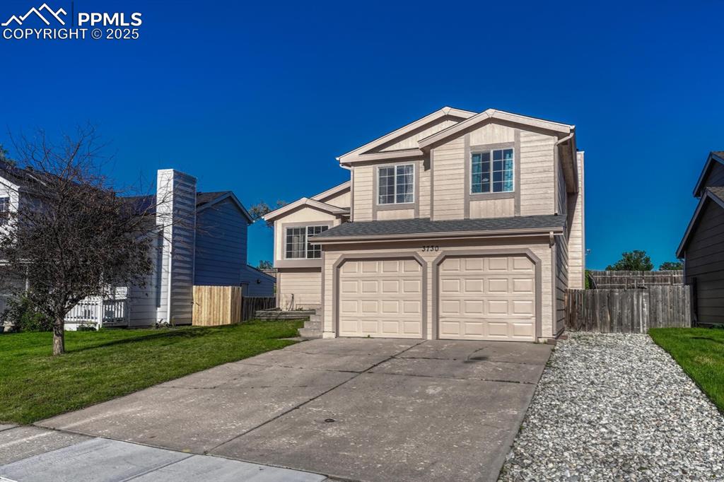 Image 5 of 47: 2 car attached garage, new roof and exterior paint