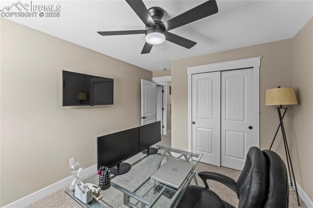 Image 33 of 44: Home office featuring baseboards and ceiling fan