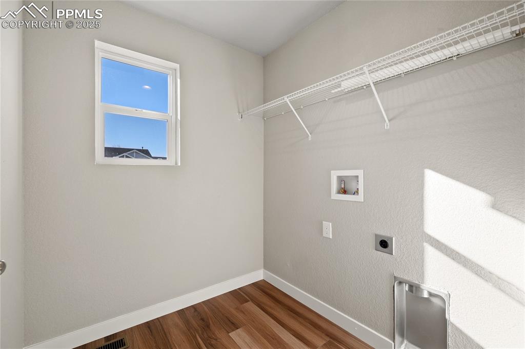 Image 24 of 38: Washroom featuring electric dryer hookup, and washer hookup