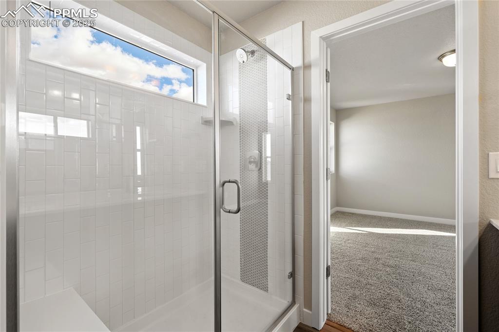 Image 35 of 38: Bathroom with a stall shower